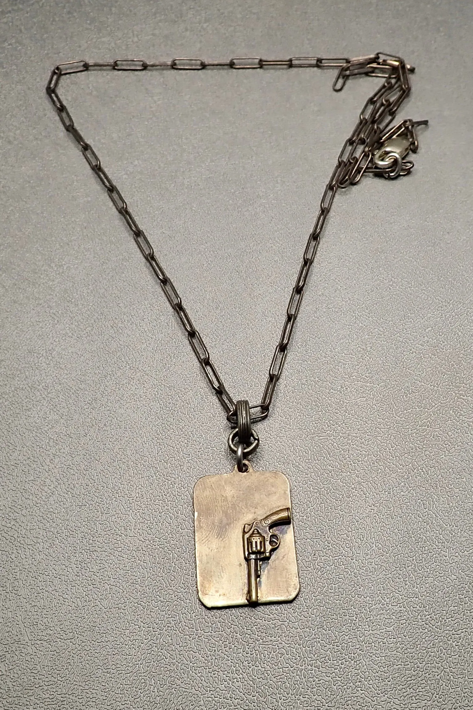 REVOLVER TAG PENDANT