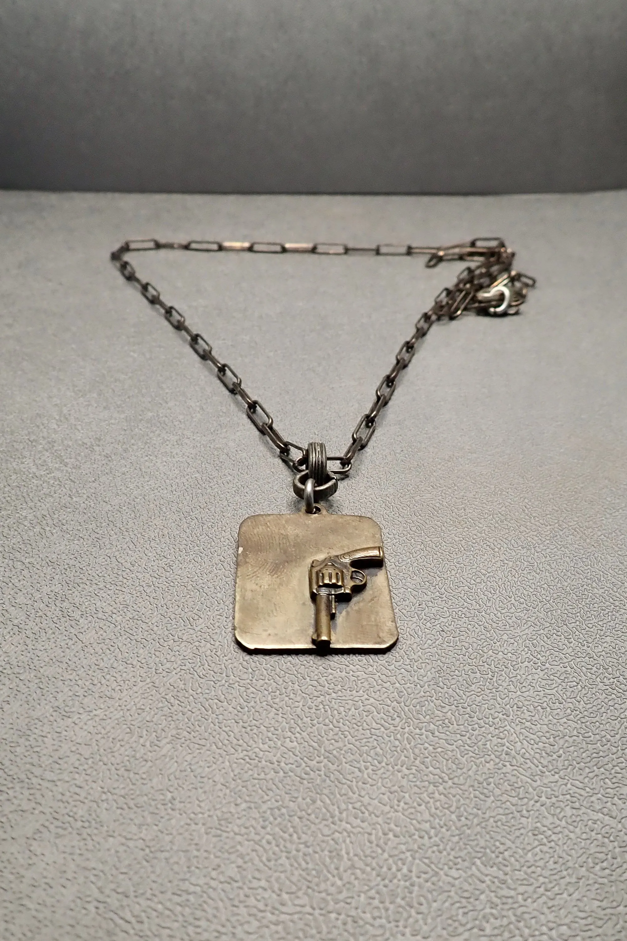 REVOLVER TAG PENDANT